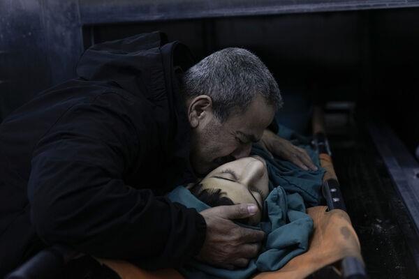 A relative mourns 15-year-old Basil Abu Al-Wafa, who was killed during an Israeli military raid on Jenin refugee camp in the West Bank on Wednesday, November 29. Picture: AP Photo/Majdi Mohammed